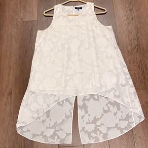 Tunic length sleeveless blouse.